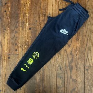Nike Black Joggers with Neon Yellow Graphic Accents